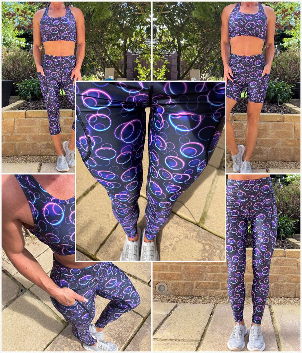 Model wearing Loopz squat proof high waisted leggings with neon pink and blue glowing circle pattern and deep thigh pockets
